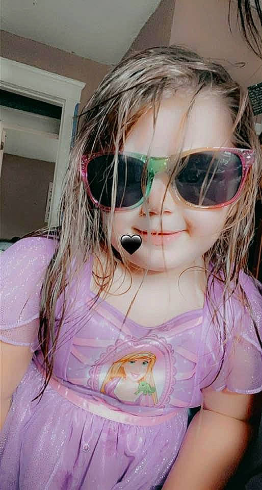 Nylah is registered to the contest to win money with this photo: bangs, cool, doll, dress, eye, eyebrow, eyelash, eyewear, happy, iris, lip, mouth, person, pink, purple, skin, smile, toy, vision_care, wig