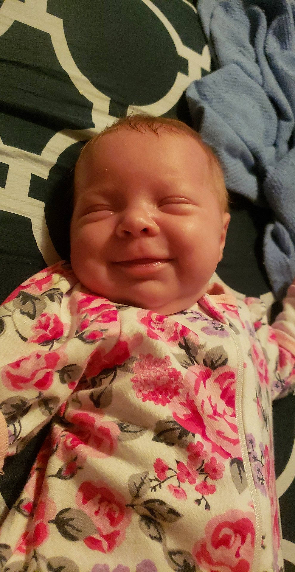 Trinity is registered to the contest to win money with this photo: baby, cheek, child, chin, face, facial_expression, finger, forehead, happy, lip, mouth, nose, organ, person, pink, skin, sleeve, smile, textile, toddler