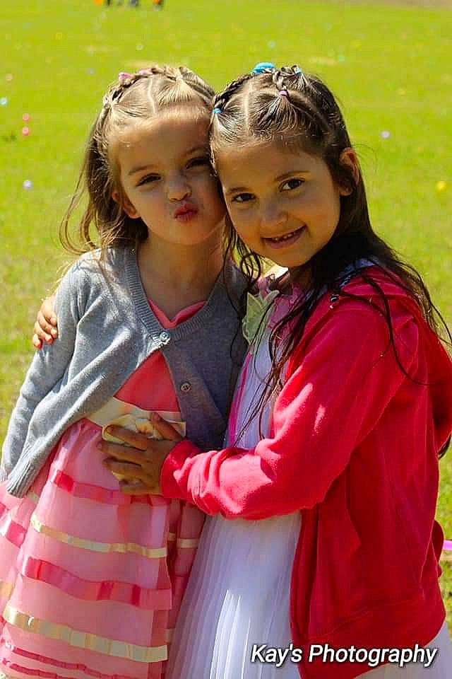 Francesca is registered to the contest to win money with this photo: child, child_model, daughter, friendship, fun, gesture, happy, headwear, hug, interaction, joy, long_hair, outerwear, person, sibling, smile