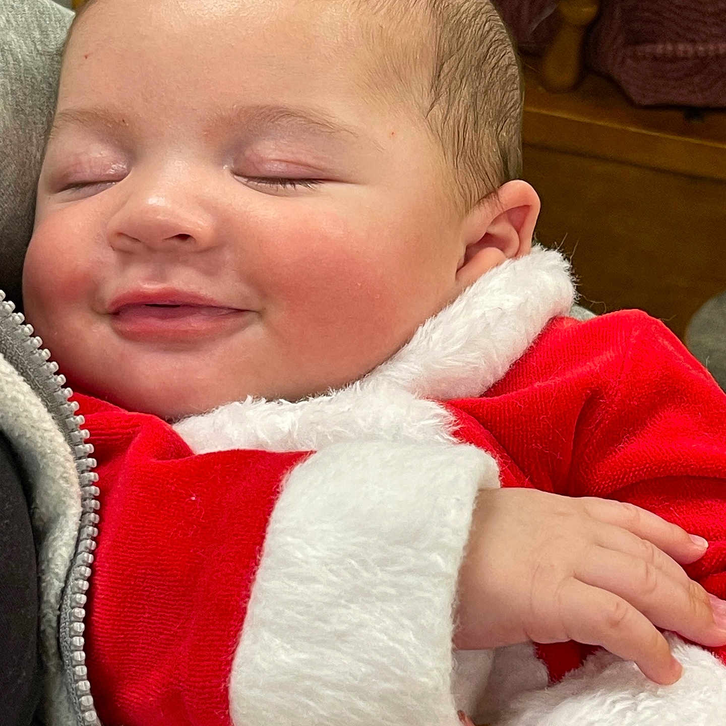 Epic is registered to the contest to win money with this photo: baby, blanket, bodypart, clothing, coat, couch, cushion, face, finger, hand, head, homedecor, jacket, knitwear, newborn, person, photography, portrait, sleeping, sweater