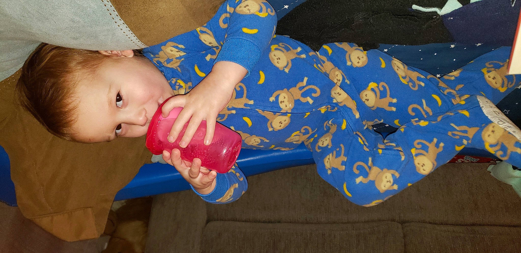 Jack is registered to the contest to win money with this photo: baby, baby_products, baby_toddler_clothing, baby_toys, child, electric_blue, finger, fun, gesture, happy, human_leg, mouth, nail, pattern, person, play, sitting, sleeve, thumb, toddler