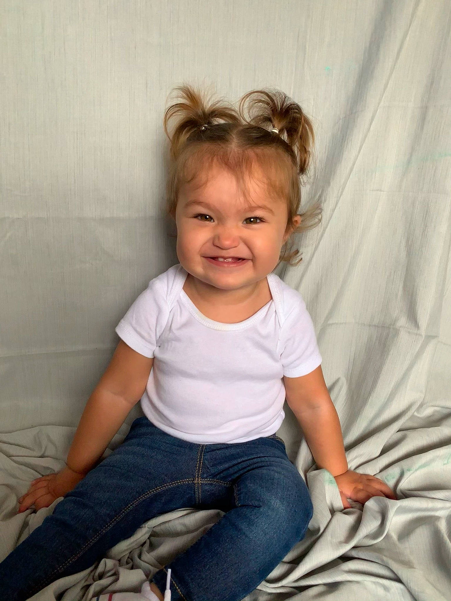 Tatum Jean is registered to the contest to win money with this photo: baby_toddler_clothing, cheek, child, clothing, comfort, eye, flash_photography, fun, hair, happy, human_leg, jeans, joy, knee, person, sitting, skin, sleeve, smile, tints_and_shades