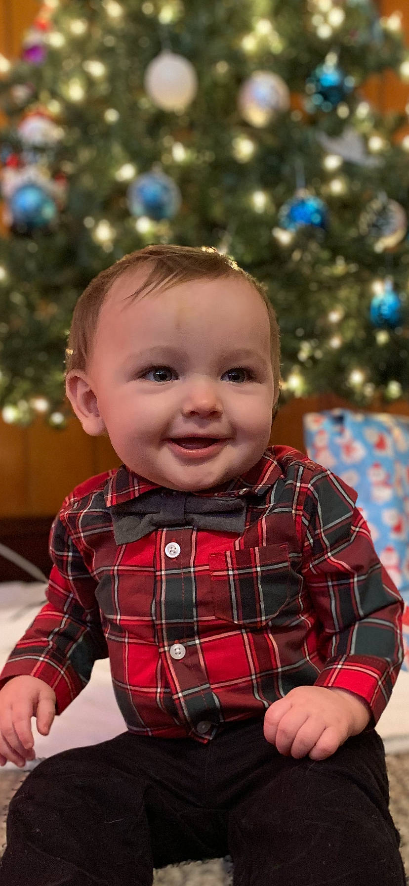 Brentley joined the competition — help win amazing prizes! baby, child, christmas, christmas_eve, christmas_tree, design, holiday, joy, pattern, person, plaid, smile, tartan, textile, toddler, tree