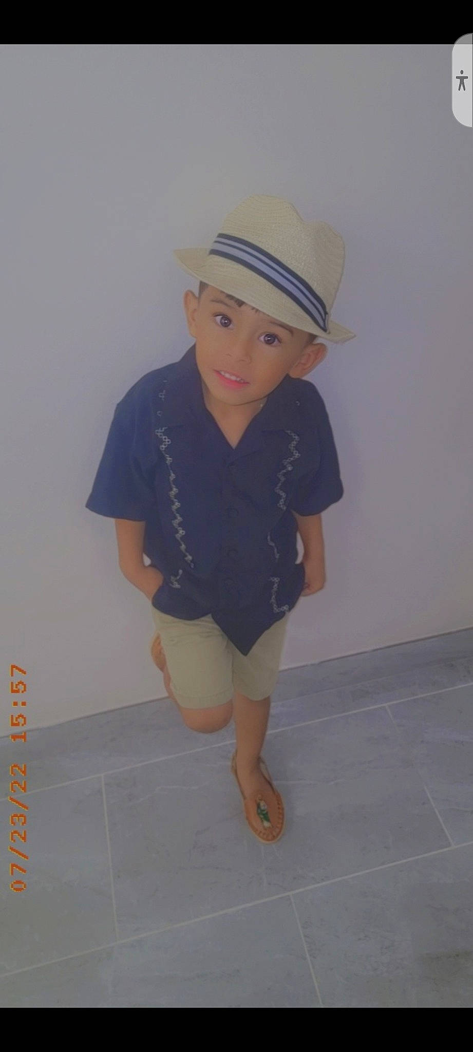 Alejandro is registered to the contest to win money with this photo: baby_toddler_clothing, barefoot, baseball_cap, cap, electric_blue, fashion_accessory, flooring, happy, hat, headgear, headwear, human_leg, knee, person, personal_protective_equipment, sleeve, sun_hat, t_shirt, thigh, toddler
