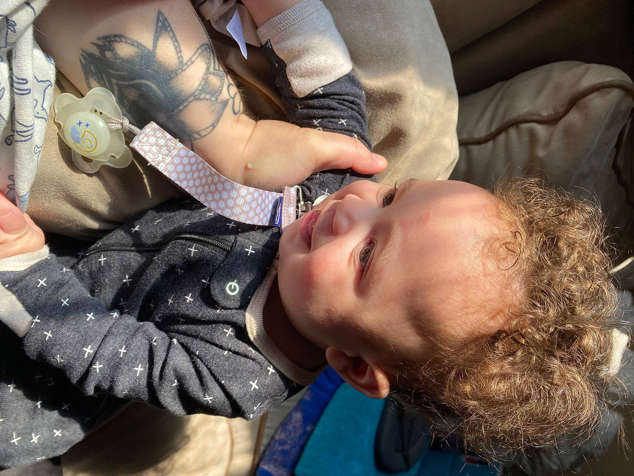 Joshua is registered to the contest to win money with this photo: arm, baby, beauty, black_hair, child, comfort, cool, eyelash, eyewear, fashion_accessory, hand, happy, mouth, organ, pattern, person, plant, sitting, skin, toddler
