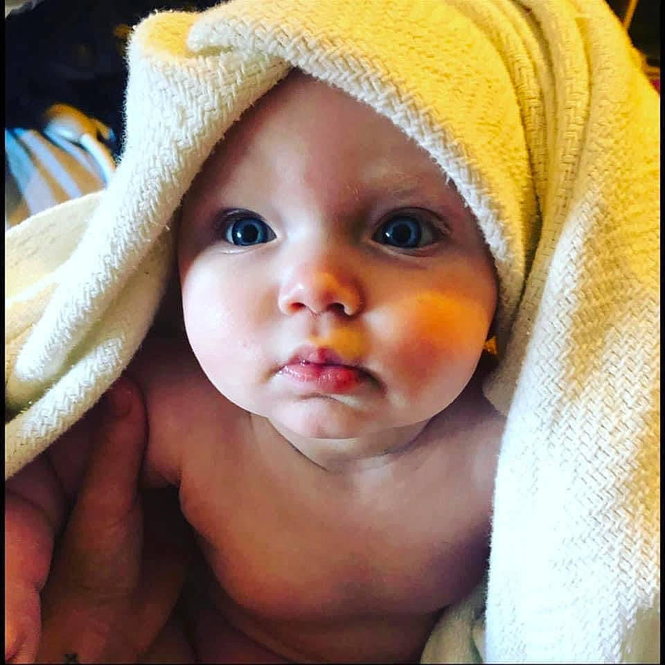 Elle joined the competition — help win amazing prizes! baby, cap, cheek, child, close_up, comfort, ear, eyebrow, eyelash, gesture, happy, headgear, headwear, iris, knit_cap, linens, lip, nose, person, skin