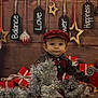 accessories, baby, bag, cap, christmas, christmasdecorations, christmastree, clothing, elf, face, festival, handbag, hat, head, person, photography, plant, portrait, pottedplant, sitting