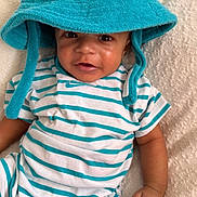 Jru joined the competition — help win amazing prizes! baby, blanket, child, closeup, clothing, cute, fabric, hand, hat, indoors, infant, laying, person, portrait, skin, smiling, soft, striped, teal, white