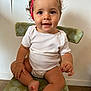 Cassie Anna June participe au concours pour gagner de l'argent avec cette photo : baby, child, curly_hair, headband, red_headband, white_onesie, chair, green_chair, patterned_chair, sitting, indoor, floor, wall, happy, smiling, cute, portrait, person, skin, furniture
