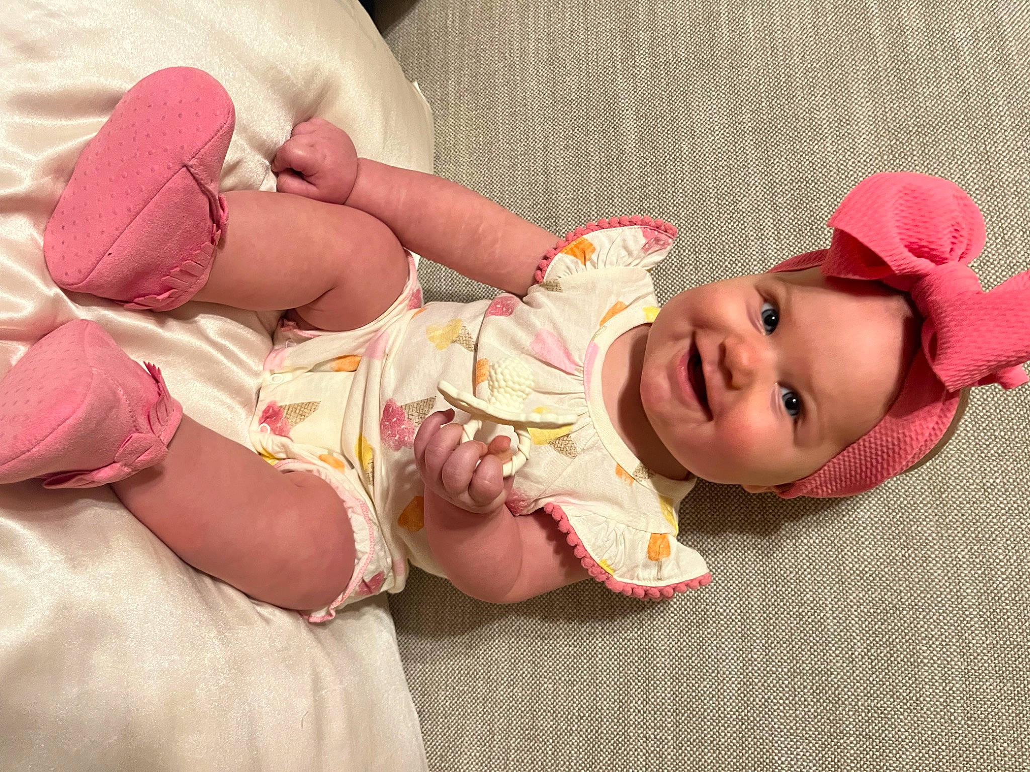 Elliana joined the competition — help win amazing prizes! baby, baby_sleeping, baby_toddler_clothing, child, comfort, eye, facial_expression, finger, headgear, human_body, human_leg, joy, knee, mouth, person, pink, skin, smile, stomach, textile