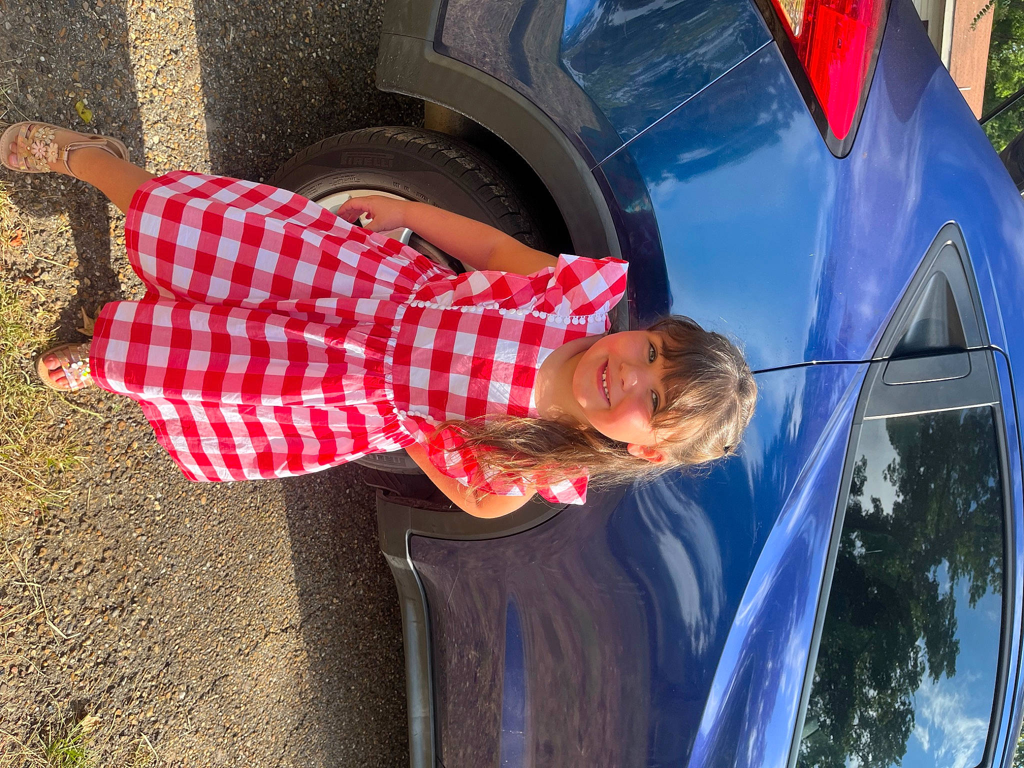 Presleigh is registered to the contest to win money with this photo: automotive_design, automotive_exterior, automotive_lighting, automotive_tire, car, electric_blue, fun, hood, joy, leisure, motor_vehicle, pattern, person, plaid, smile, tartan, tints_and_shades, tire, vehicle, vehicle_door