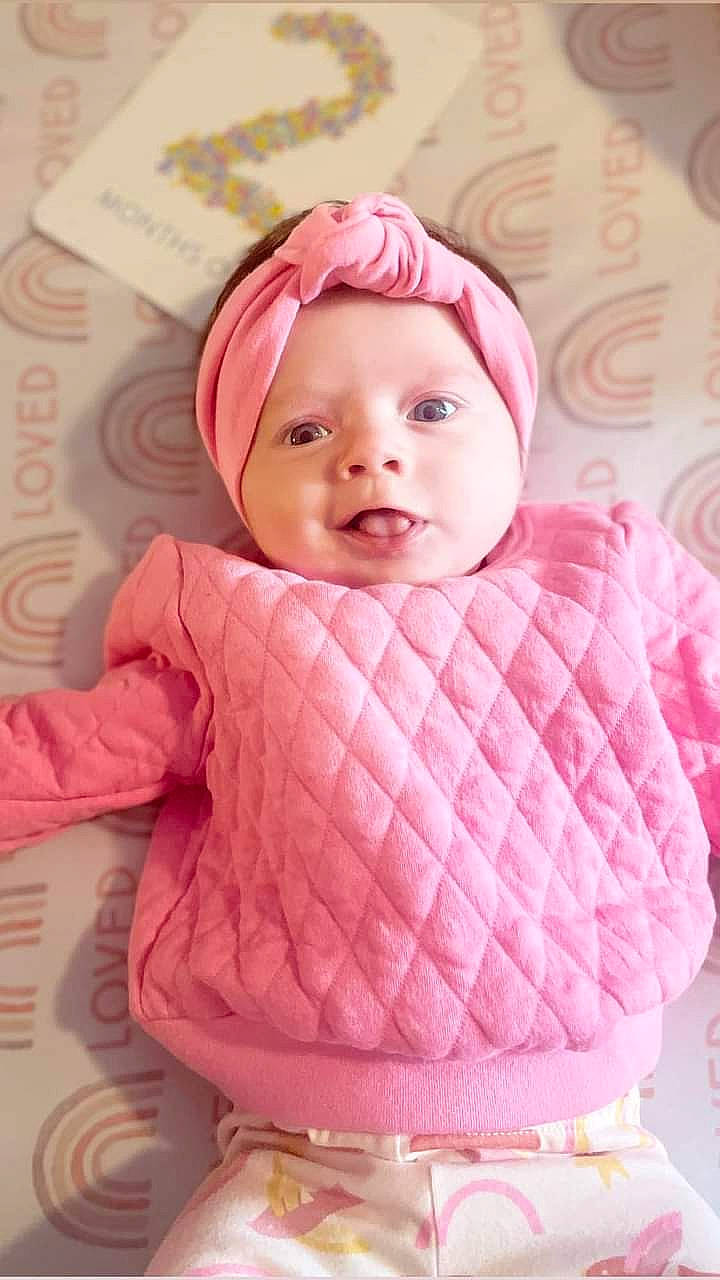 Annalee joined the competition — help win amazing prizes! baby, baby_toddler_clothing, cap, cheek, child, clothing, dress, facial_expression, headgear, headwear, linens, lip, magenta, outerwear, person, pink, product, skin, sleeve, smile