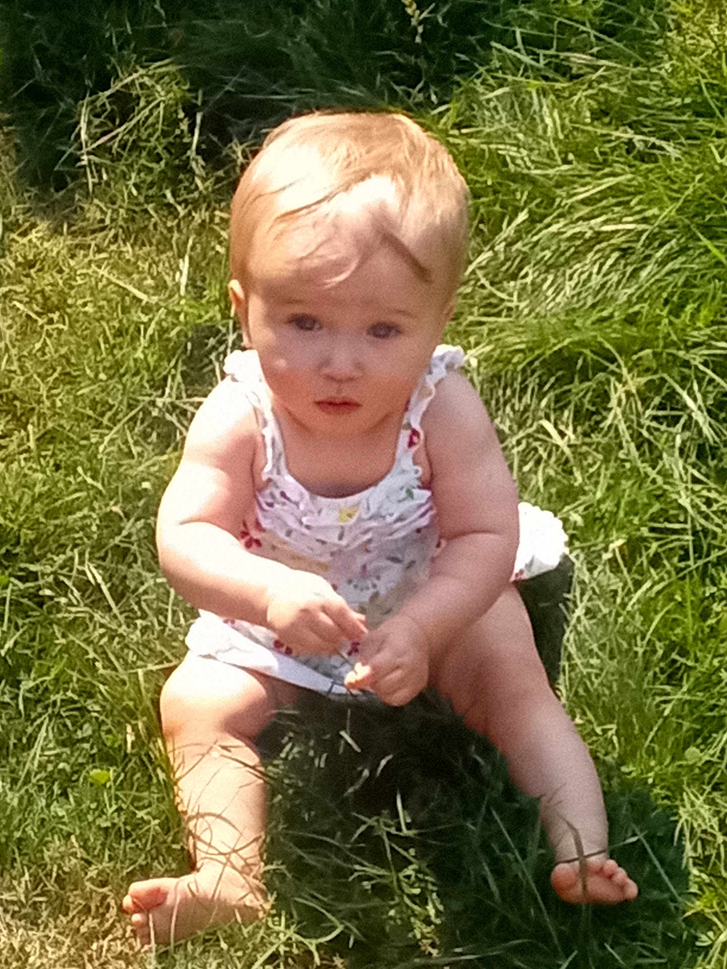 Alaeleea joined the competition — help win amazing prizes! baby, child, grass, outdoor, barefoot, greenery, sunlight, infant, dress, curious, sitting, nature, summer, young, person, skin, legs, hands, face, hair