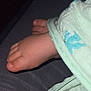 baby_feet, bed, blanket, child, close_up, comfort, cover, cozy, fabric, foot, infancy, infant, pale_skin, relaxation, resting, skin, sleepwear, soft, textile, toes