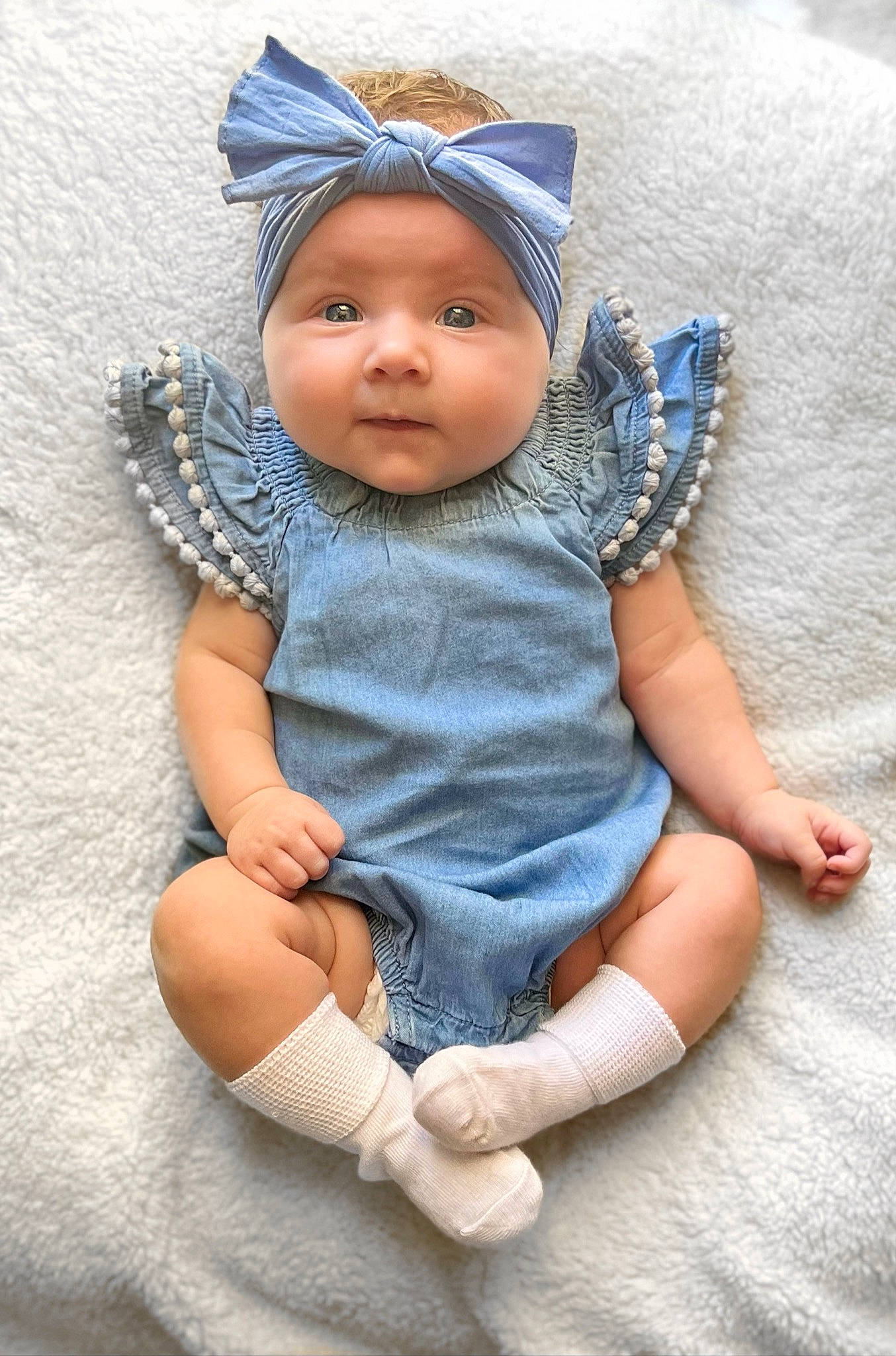Caleigh is registered to the contest to win money with this photo: baby, baby_products, baby_toddler_clothing, cap, cheek, child, comfort, costume_hat, denim, electric_blue, fashion_accessory, finger, grey, headgear, headwear, linens, pattern, person, skin, sleeve