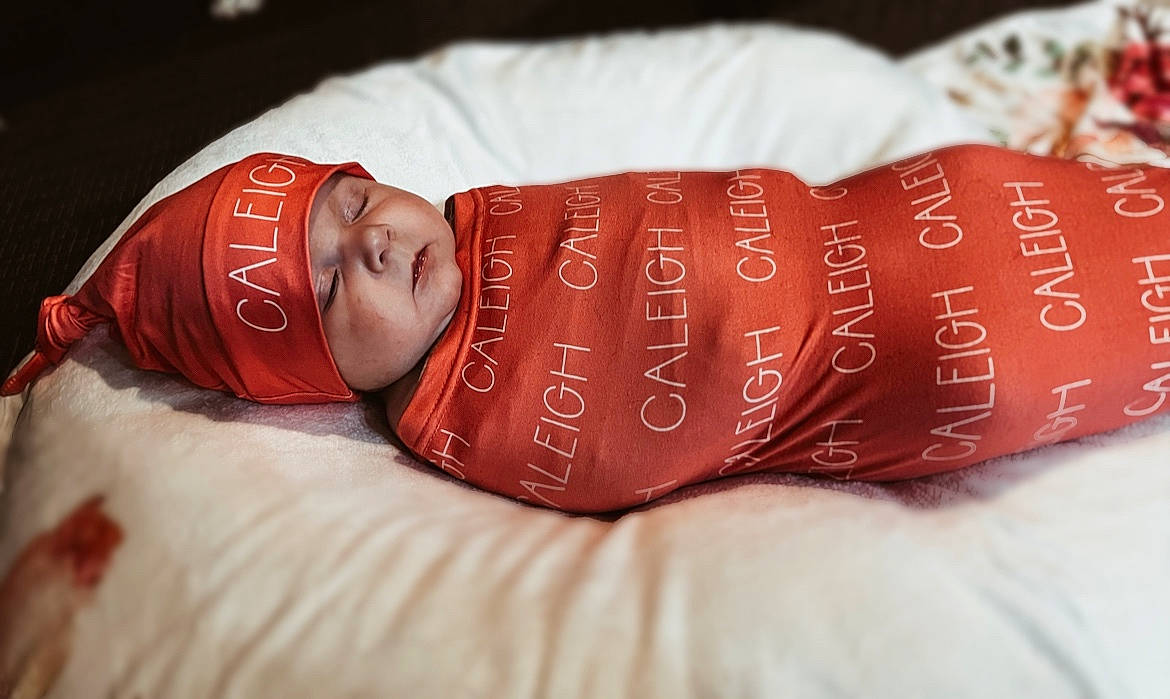 Caleigh is registered to the contest to win money with this photo: abdomen, baby, baby_products, carmine, chest, child, comfort, elbow, fashion_accessory, finger, flesh, headwear, health_care, human_body, human_leg, jewellery, linens, nail, person, skin