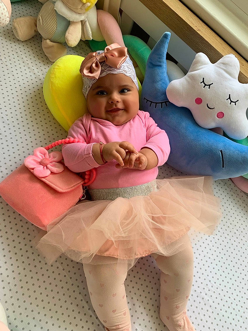 Aryanna is registered to the contest to win money with this photo: baby, child, costume, ear, person, pink, plush, smile, stuffed_toy, toddler, toy