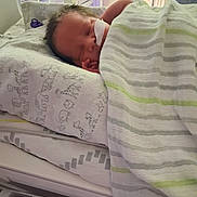 Maverick Gross-Davis joined the competition — help win amazing prizes! newborn, baby, hospital, crib, blanket, sleeping, nasal_tube, bedding, animal_print, striped_blanket, infant, medical, peaceful, child, bed, indoors, healthcare, cute, resting, soft
