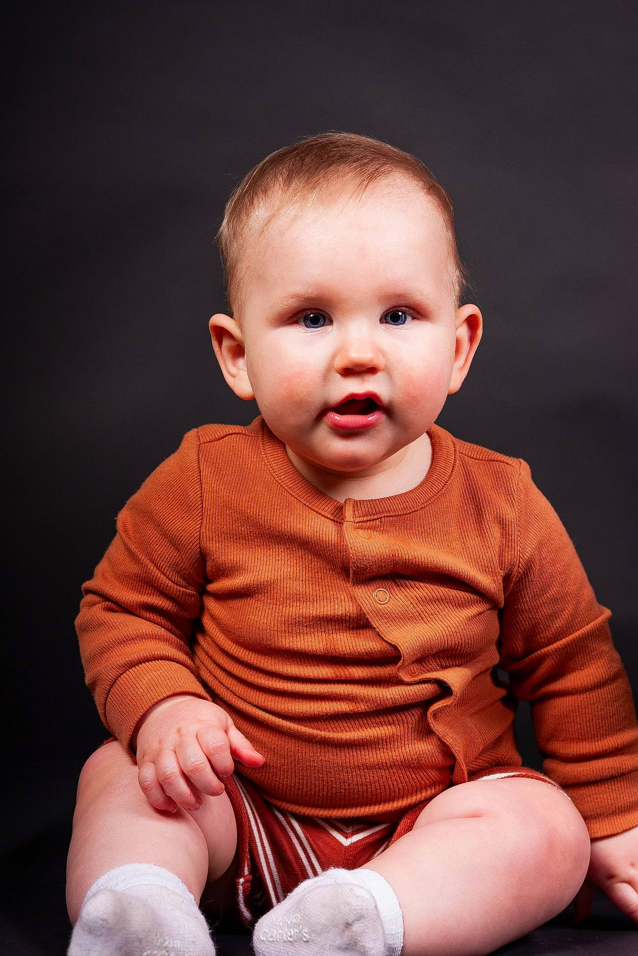Emmett James joined the competition — help win amazing prizes! baby, baby_toddler_clothing, cheek, child, collar, finger, flash_photography, happy, human_leg, knee, pattern, person, portrait, portrait_photography, sitting, skin, sleeve, sock, t_shirt, thigh