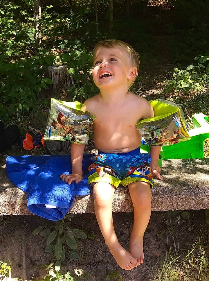 Titus is registered to the contest to win money with this photo: board_short, child, fun, joy, jungle, leisure, person, play, shorts, summer, vacation, water