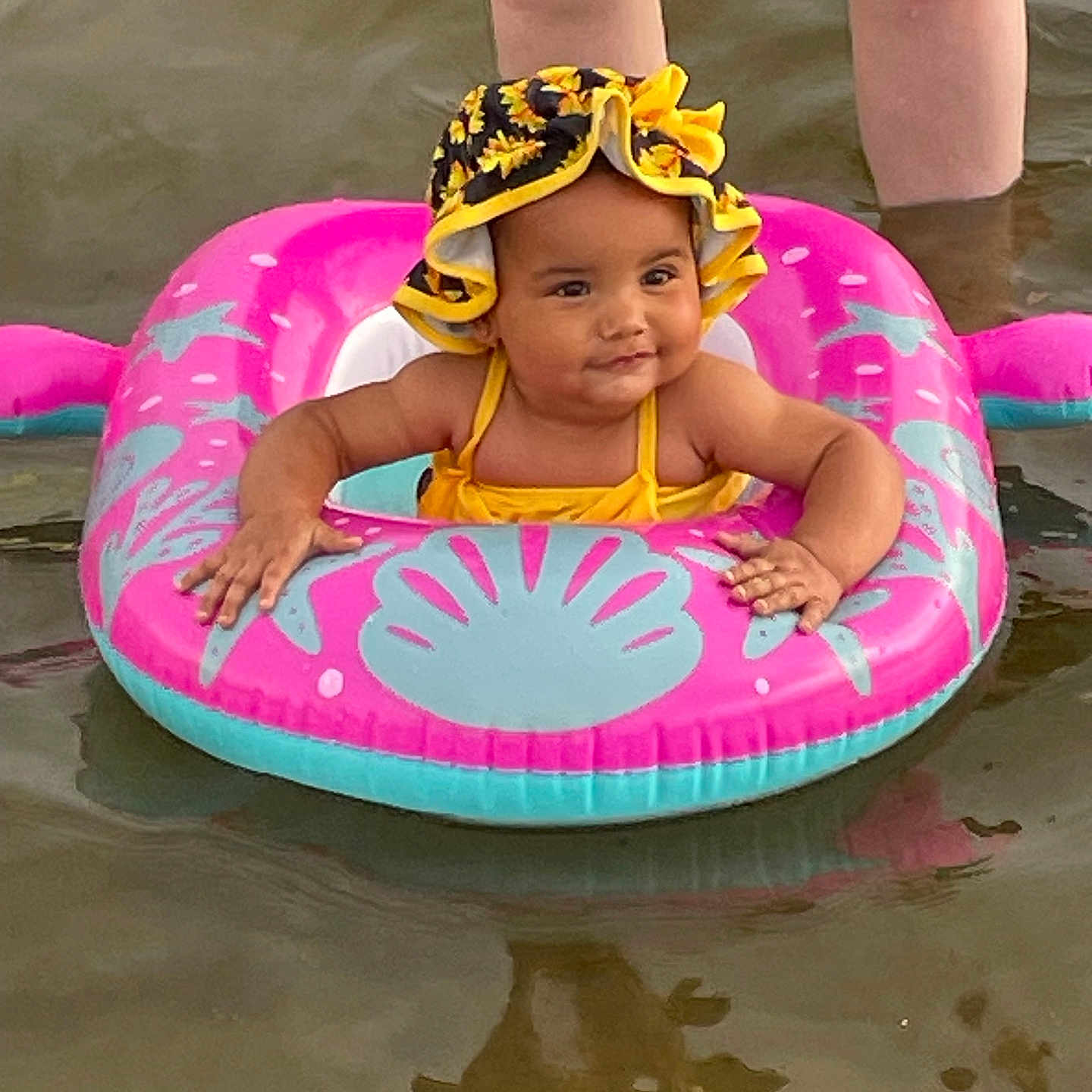 Aniyah joined the competition — help win amazing prizes! baby, cap, clothing, face, hat, head, leisureactivities, lifejacket, person, photography, pool, portrait, sport, summer, swimming, swimwear, tubing, vest, water, watersports