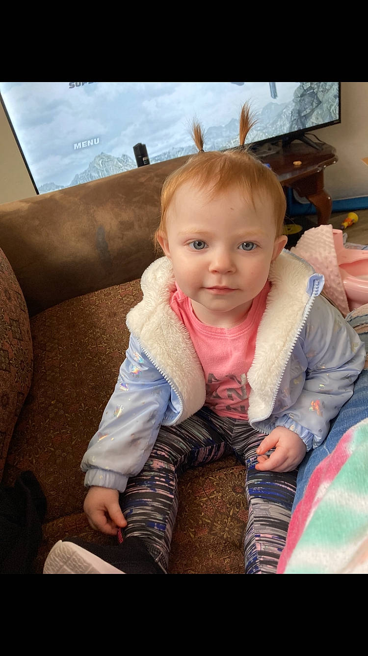 Emma joined the competition — help win amazing prizes! baby, baby_products, baby_toddler_clothing, cheek, child, comfort, couch, eye, face, flooring, fun, happy, head, iris, mammal, person, sitting, skin, sleeve, television