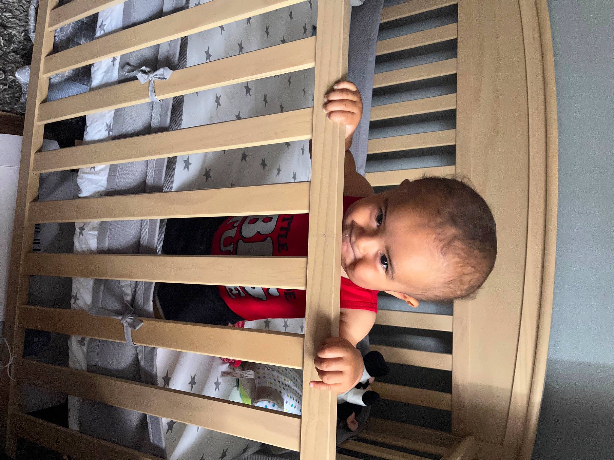 Desmond is registered to the contest to win money with this photo: apartment, baby, baby_toddler_clothing, building, child, daylighting, facade, hardwood, house, line, material_property, metal, organ, pattern, person, room, shade, toddler, tree, window