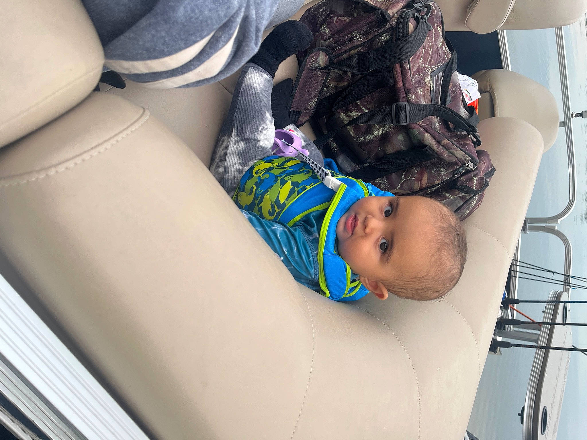 Desmond is registered to the contest to win money with this photo: auto_part, automotive_design, automotive_exterior, baby, baby_products, baby_toddler_clothing, car_seat, car_seat_cover, child, comfort, family_car, fun, head_restraint, leg, motor_vehicle, pattern, person, personal_protective_equipment, seat_belt, toddler