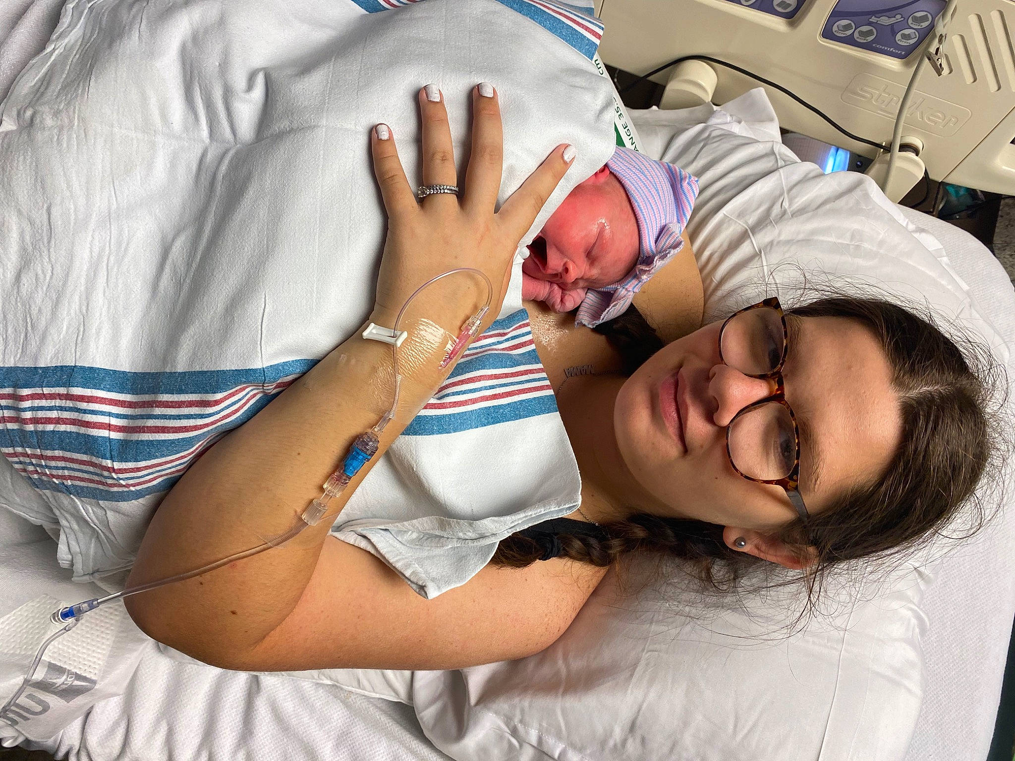 Madalyn is registered to the contest to win money with this photo: child, comfort, elbow, event, eyewear, finger, fun, gesture, hand, happy, health_care, human_leg, joint, leisure, linens, mouth, patient, person, smile, thigh