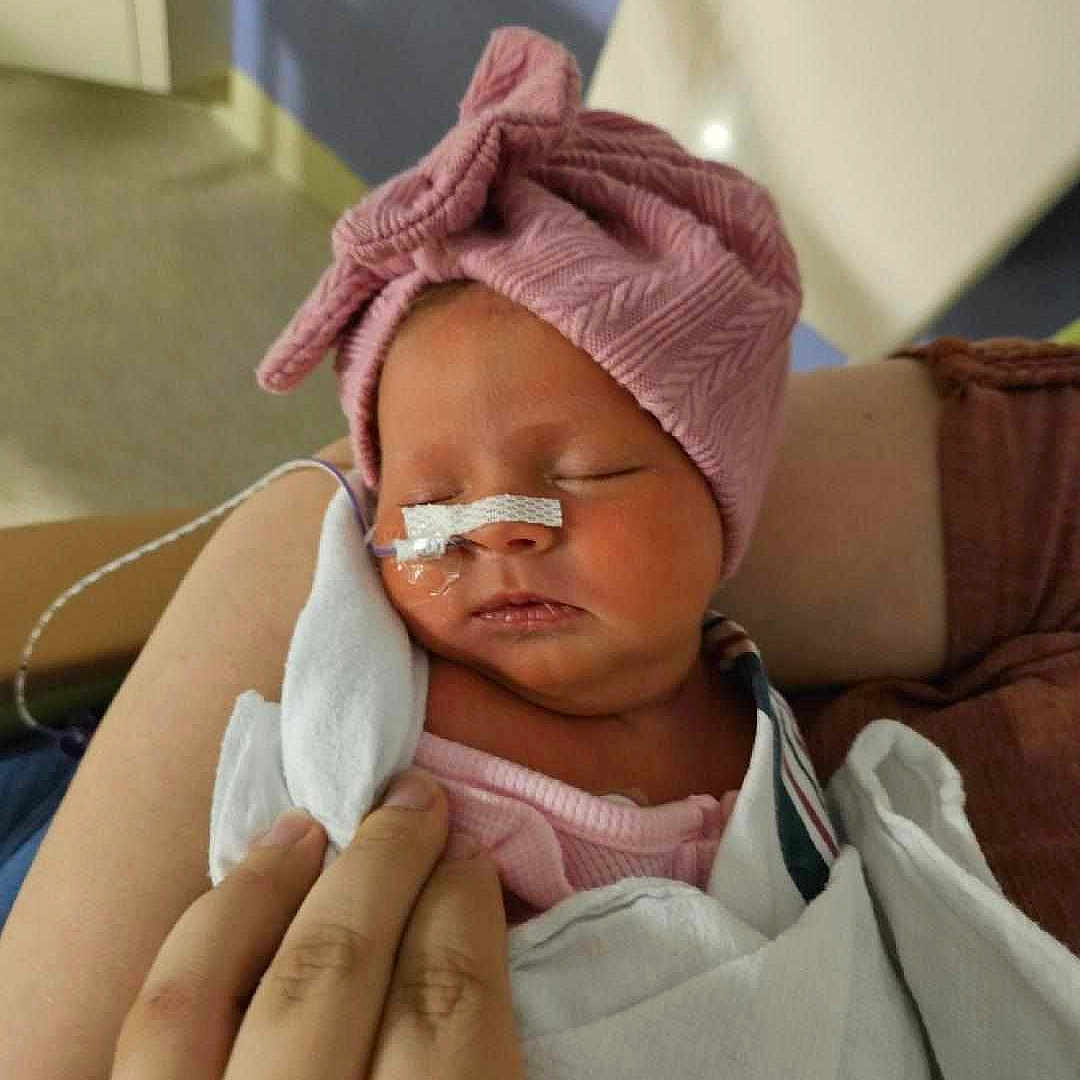 O'Livia joined the competition — help win amazing prizes! architecture, baby, blanket, bodypart, bonnet, building, childbirth, clothing, face, finger, glove, hand, hat, head, hospital, newborn, person, photography, portrait, sleeping