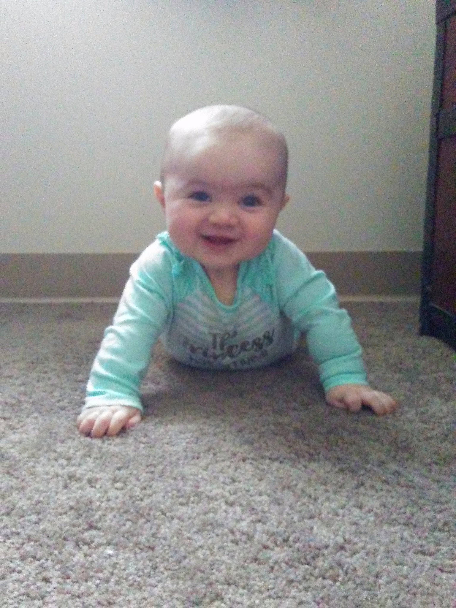 Anya is registered to the contest to win money with this photo: arm, boy, child, crawling, day, eye, finger, floor, flooring, fun, head, infant, joy, organ, person, play, product, sitting, skin, standing