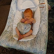 Tanner is registered to the contest to win money with this photo: baby, newborn, infant, baby_rocker, bib, cushion, indoor, carpet, floor, sleeping, peaceful, infant_clothing, baby_boy, baby_seat, baby_sleeping, head, small_hands, small_feet, soft_lighting, home