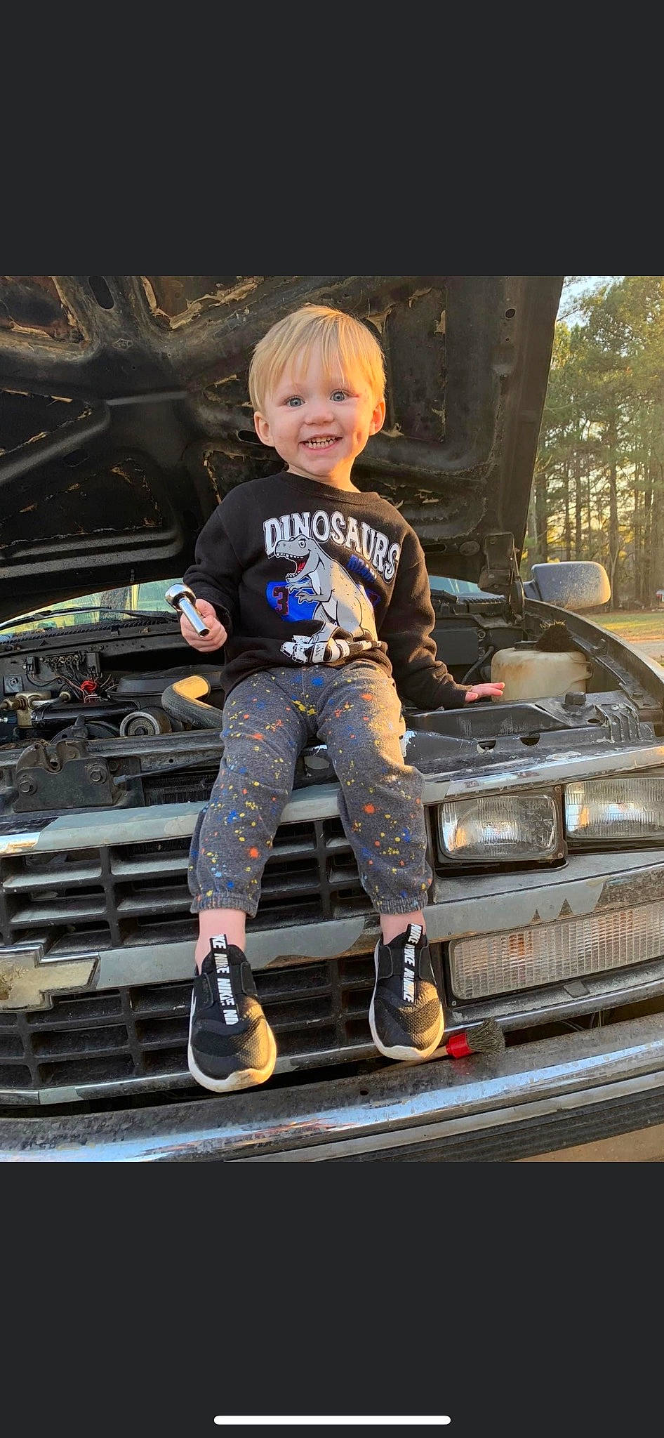 Dexter joined the competition — help win amazing prizes! auto_part, automotive_design, automotive_exterior, automotive_lighting, automotive_tire, automotive_wheel_system, bumper, child, electric_blue, family_car, flash_photography, hood, joy, motor_vehicle, person, rolling, shoe, smile, sneakers, toddler