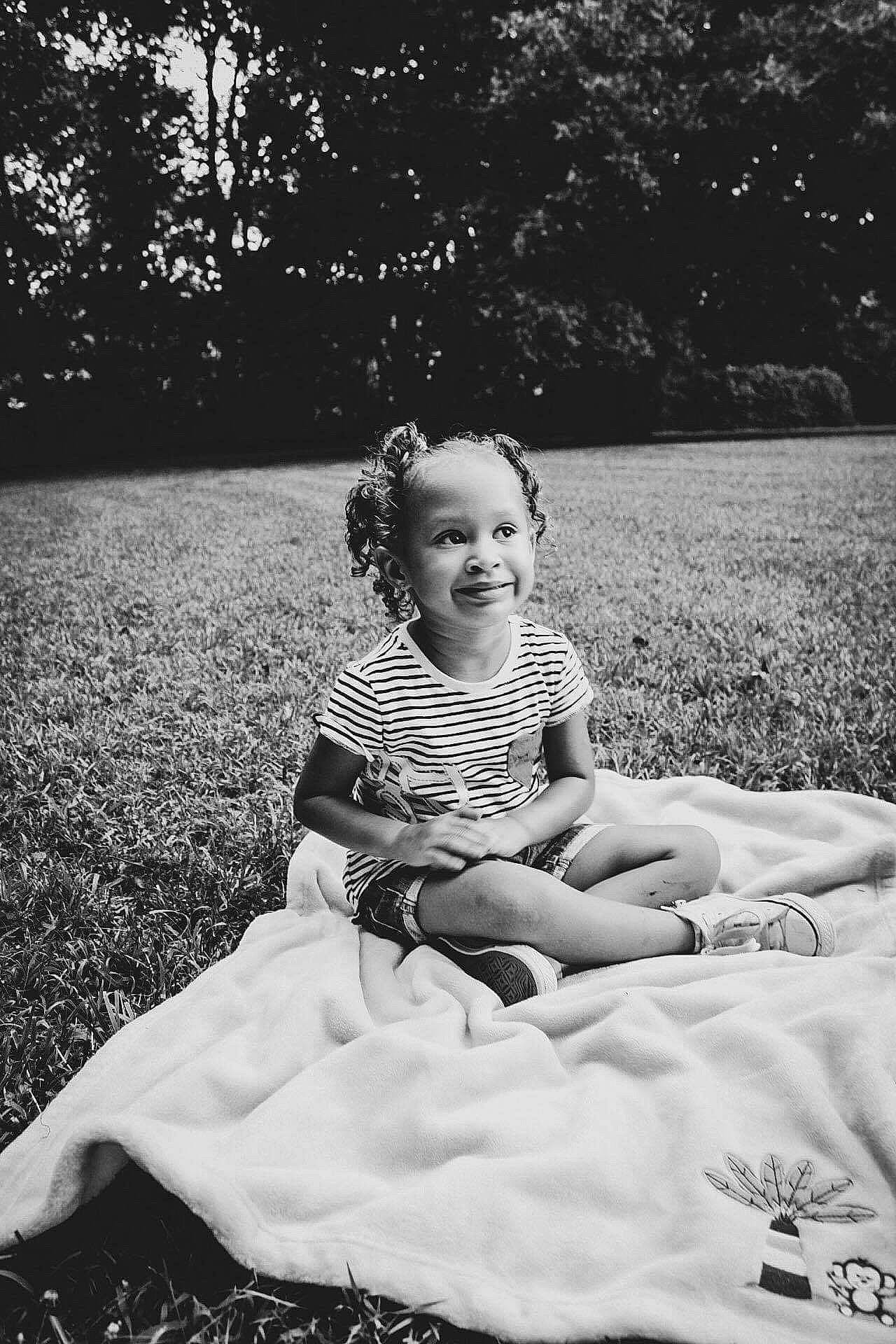 Kassie joined the competition — help win amazing prizes! black_and_white, child, dress, eye, family, grass, happy, monochrome, monochrome_photography, people, person, photograph, photography, recreation, sitting, smile, snapshot, stock_photography, toddler, tree
