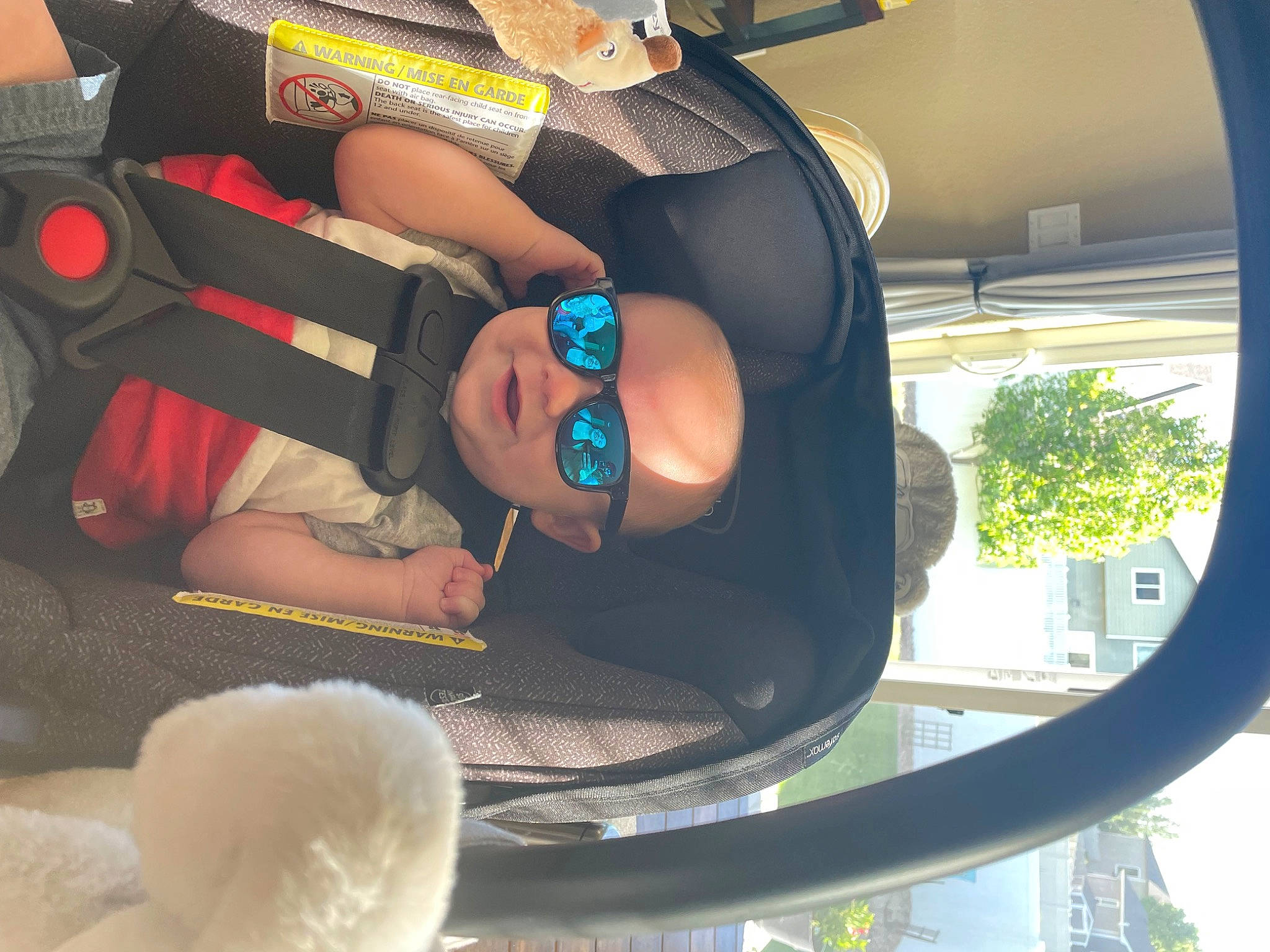 Daxton joined the competition — help win amazing prizes! auto_part, automotive_mirror, baby, baby_products, cap, car_seat, comfort, eyewear, fashion_accessory, goggles, hat, headgear, person, personal_protective_equipment, plant, sun_hat, thigh, toddler, tree, white