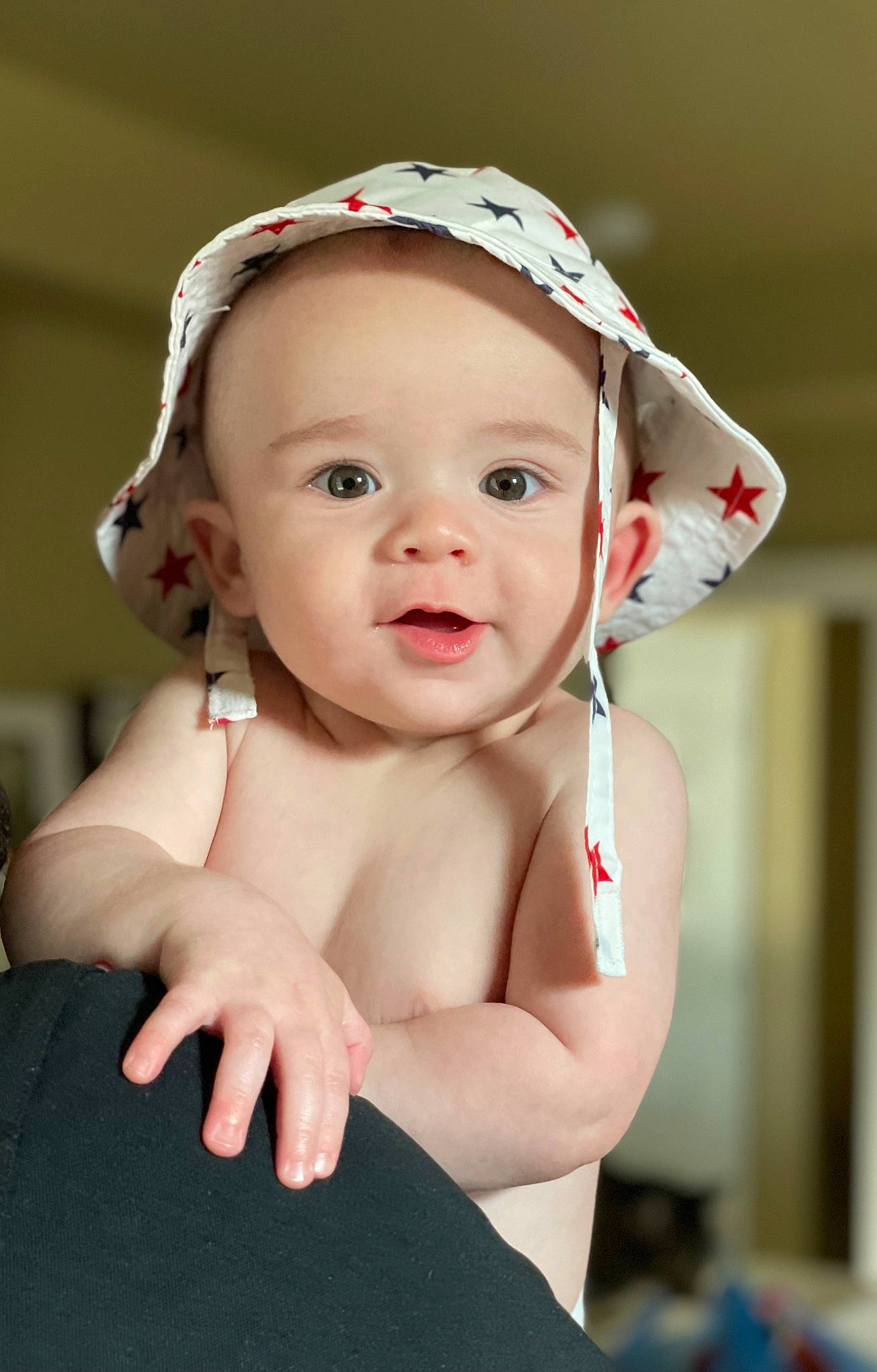 Daxton is registered to the contest to win money with this photo: arm, baby, baby_toddler_clothing, cap, cheek, child, eye, eyelash, fashion_accessory, flash_photography, gesture, happy, headband, headgear, headpiece, lip, person, pink, skin, smile