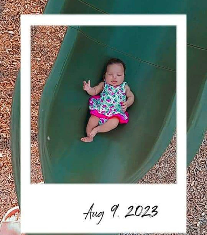 Lyrica is registered to the contest to win money with this photo: baby, baby_toddler_clothing, child, clothing, comfort, fun, grass, leisure, magenta, pattern, person, pink, play, product, recreation, rectangle, room, sleeve, t_shirt, tints_and_shades