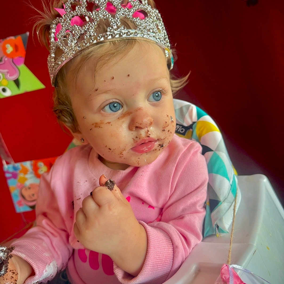 Kaizlyn joined the competition — help win amazing prizes! birthday, blue_eyes, cake, celebration, child, crumbs, curly_hair, cute, food, fun, happy, high_chair, indoor, messy_face, party, pink_sweater, portrait, tiara, toddler, young_child