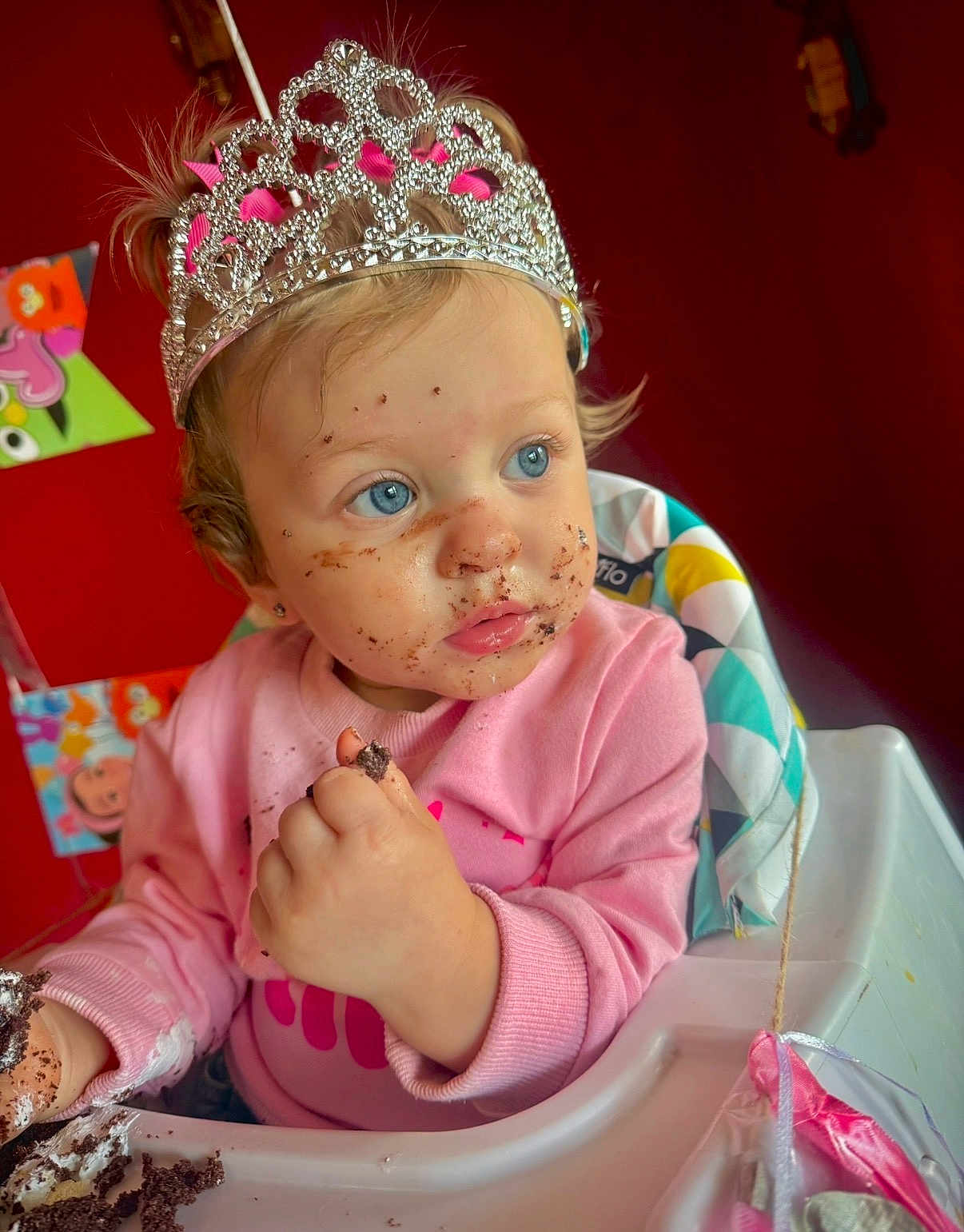 Kaizlyn joined the competition — help win amazing prizes! birthday, blue_eyes, cake, celebration, child, crumbs, curly_hair, cute, food, fun, happy, high_chair, indoor, messy_face, party, pink_sweater, portrait, tiara, toddler, young_child