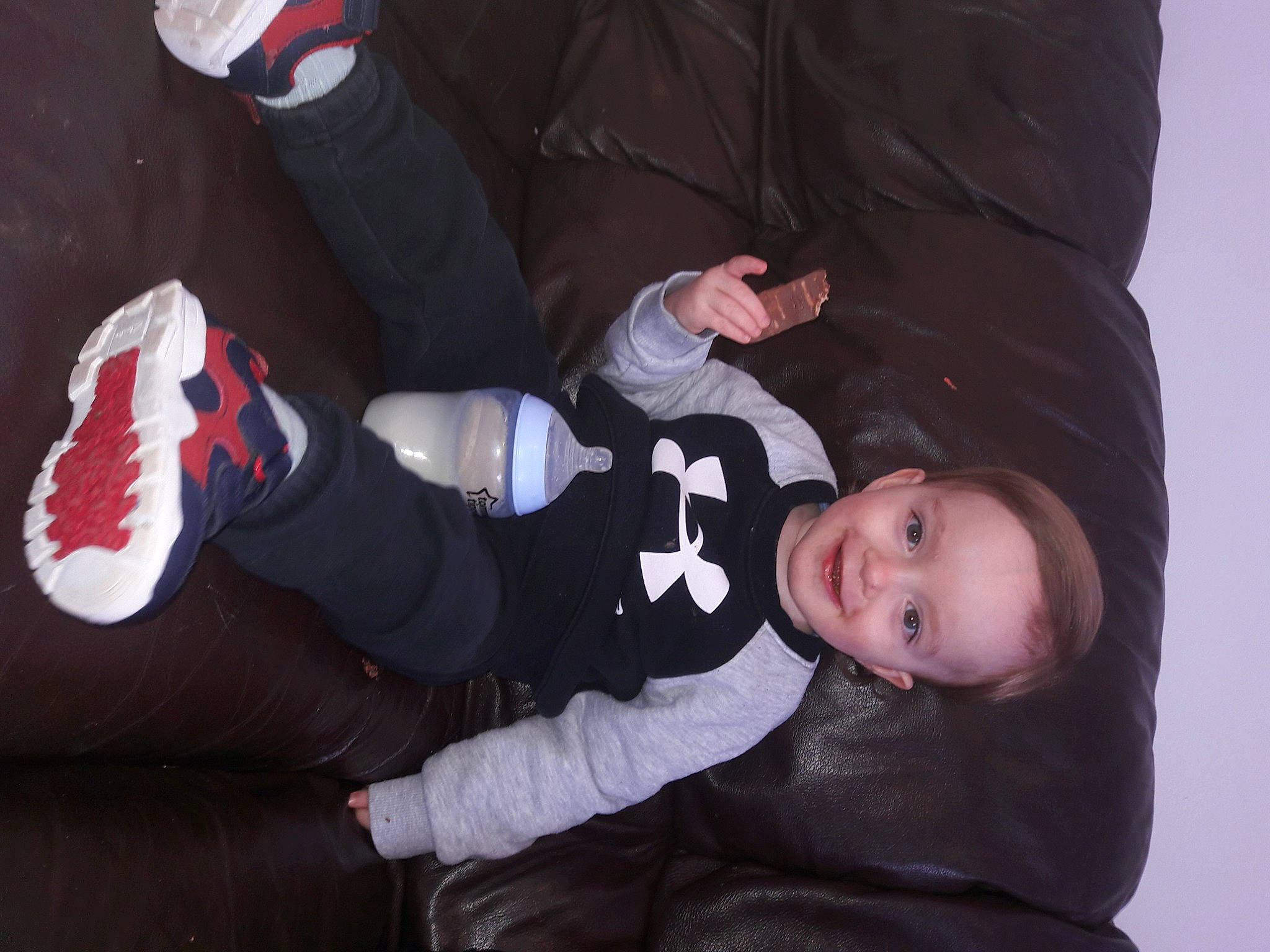 Layton James joined the competition — help win amazing prizes! baby, baby_toddler_clothing, carmine, child, comfort, cool, finger, fun, gesture, glove, human_leg, joy, lap, leg, person, sitting, sleeve, sneakers, sock, toddler