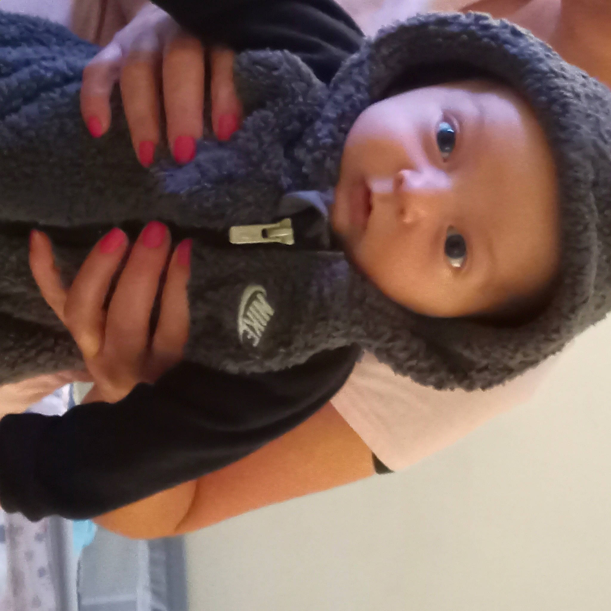 Jacob is registered to the contest to win money with this photo: baby, black_hair, cap, cheek, chest, child, doll, elbow, eye, eyelash, fashion_accessory, fur, gesture, headwear, knee, nail, person, sleeve, thumb, toy