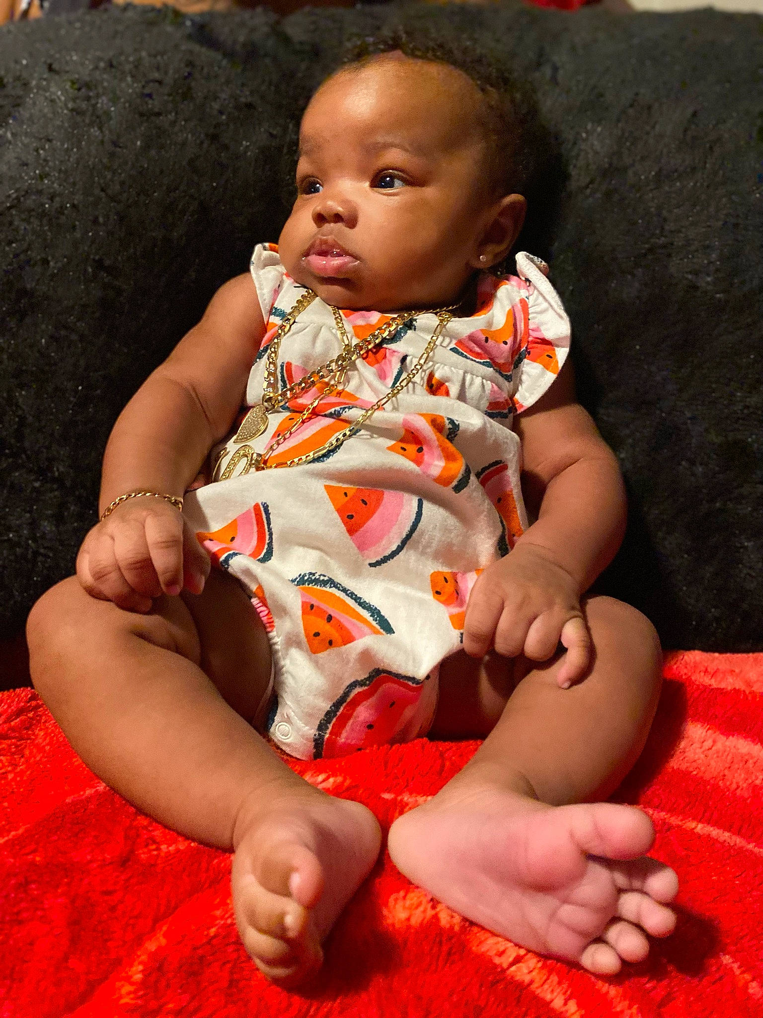 Honor is registered to the contest to win money with this photo: arm, baby, baby_toddler_clothing, cheek, comfort, face, facial_expression, finger, fun, happy, joint, lap, mouth, person, pink, product, red, skin, stomach, thigh