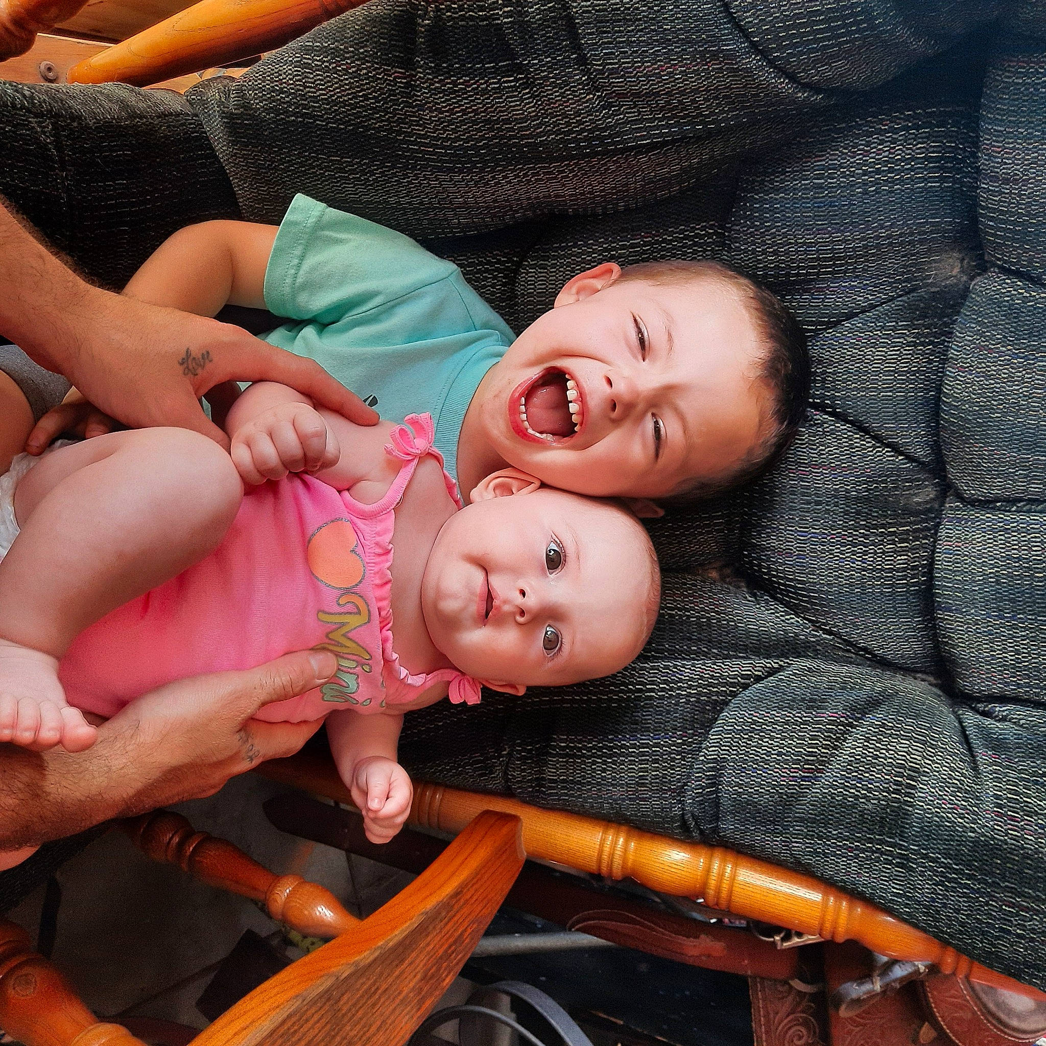 Ryder is registered to the contest to win money with this photo: baby, baby_laughing, baby_products, baby_toddler_clothing, cheek, chest, child, comfort, doll, fun, grass, happy, hat, iris, lip, mouth, person, skin, smile, thigh