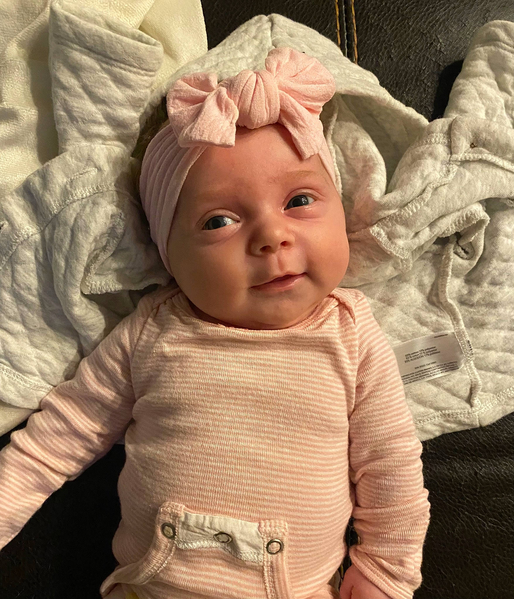 Layton is registered to the contest to win money with this photo: baby_toddler_clothing, cap, cheek, chin, comfort, eye, eyebrow, face, forehead, hairstyle, head, headwear, human_body, lip, mouth, neck, nose, organ, person, skin