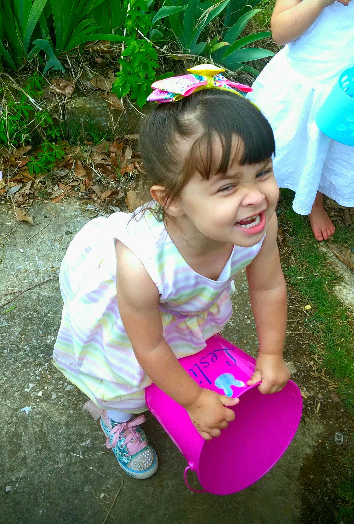 Leslie joined the competition — help win amazing prizes! arm, baby_toddler_clothing, blue, botany, clothing, grass, green, hand, happy, joy, leaf, people_in_nature, person, pink, plant, purple, shoe, skin, smile, sneakers