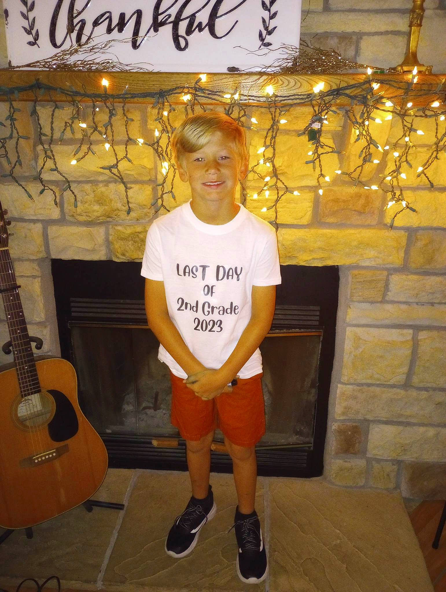 Carson joined the competition — help win amazing prizes! cool, flooring, font, fun, guitar, guitar_accessory, happy, joy, knee, musical_instrument, musical_instrument_accessory, orange, organ, person, plucked_string_instruments, shorts, smile, string_instrument, string_instrument_accessory, t_shirt