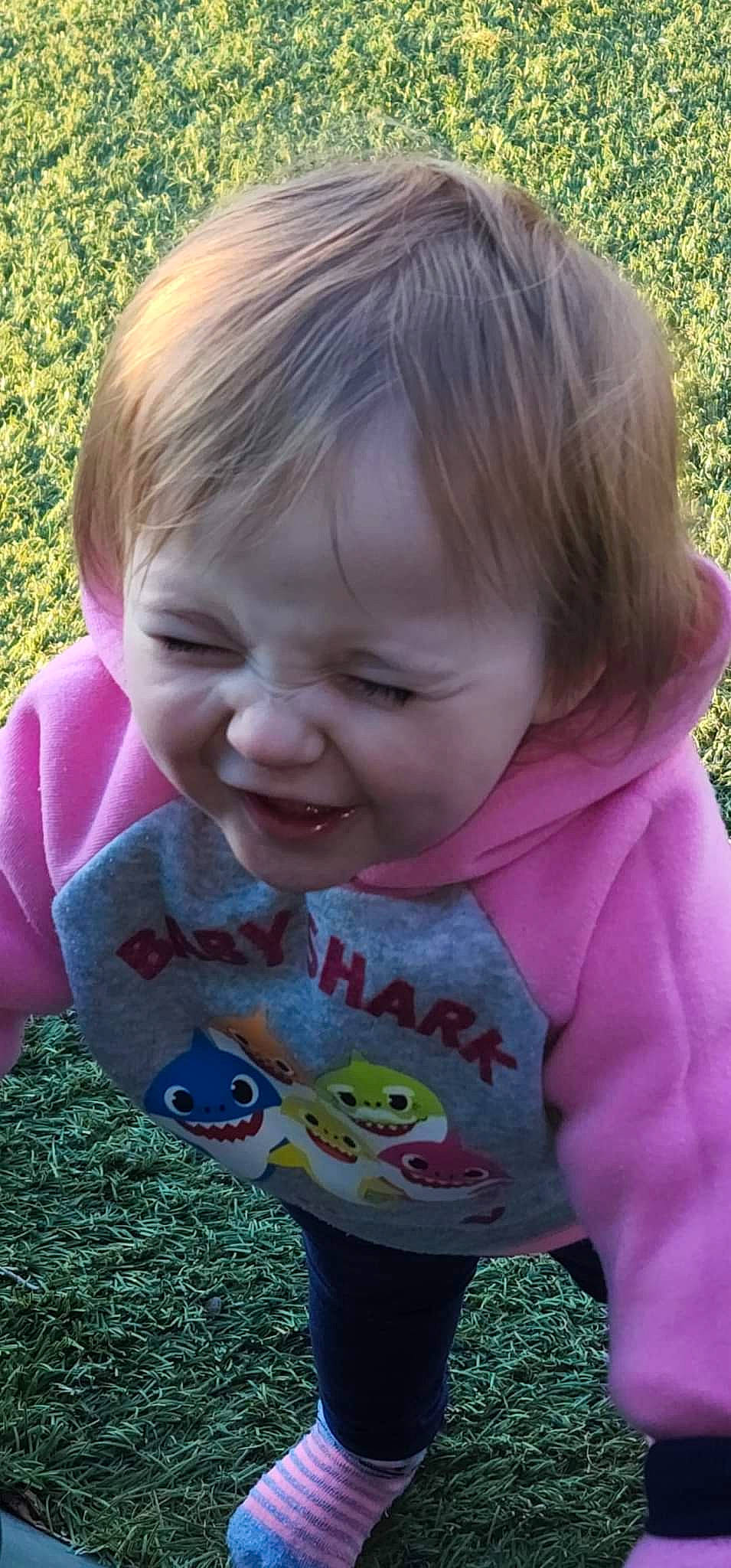 Emmaleigh joined the competition — help win amazing prizes! baby_toddler_clothing, cheek, clothing, eye, face, facial_expression, grass, hair, happy, head, iris, lip, mouth, nose, outerwear, people_in_nature, person, pink, product, skin