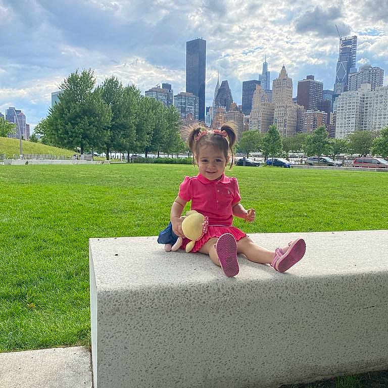 Tasneem joined the competition — help win amazing prizes! architecture, building, child, city, cityscape, face, female, furniture, girl, grass, head, nature, outdoors, park, person, photography, plant, portrait, sitting, urban
