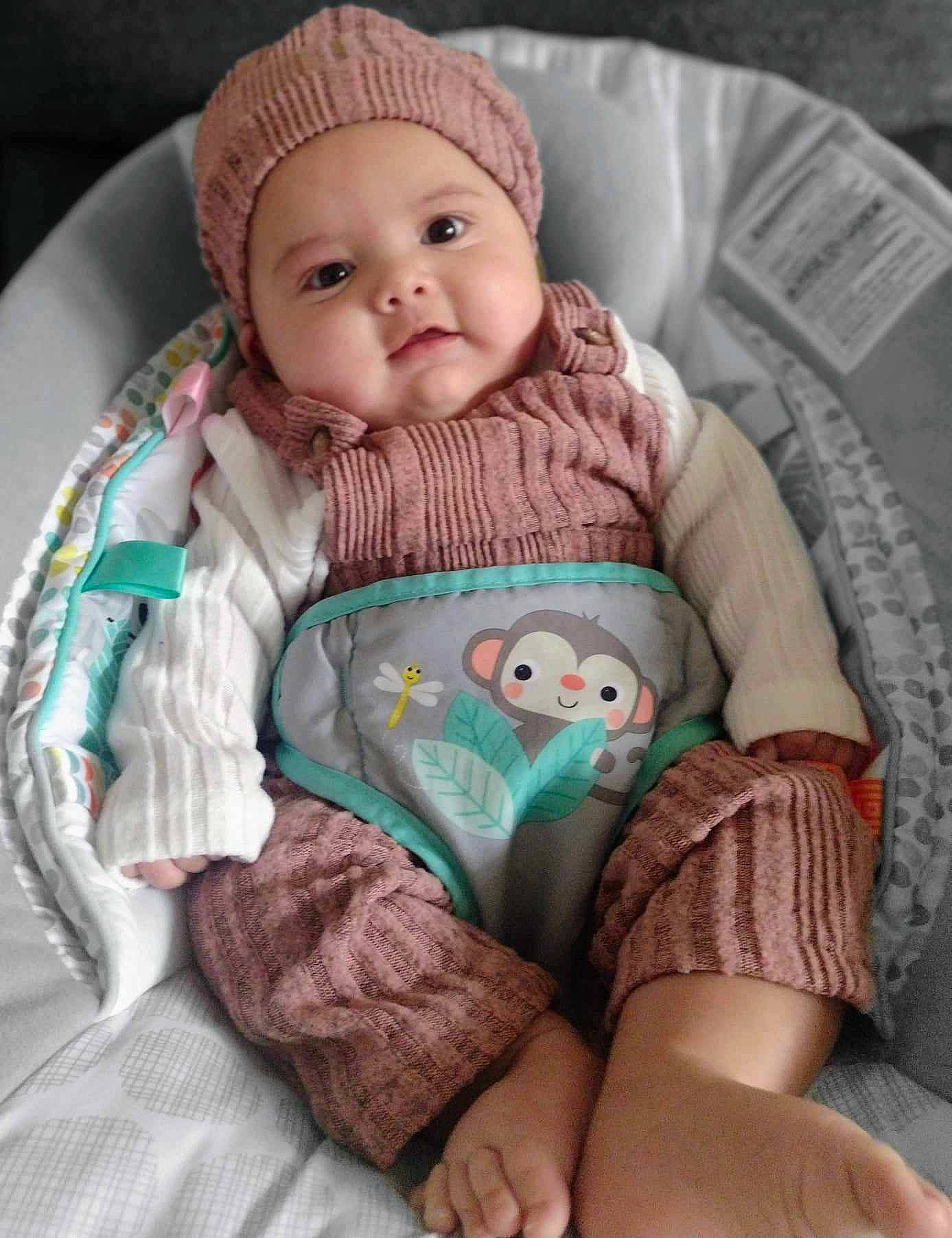 Arabella joined the competition — help win amazing prizes! baby, baby_products, baby_sleeping, baby_toddler_clothing, beanie, cap, cheek, child, comfort, headwear, human_body, knit_cap, linens, person, pink, sitting, skin, sleeve, thigh, toddler