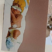 Amari is registered to the contest to win money with this photo: baby, blanket, booties, child, cute, diaper, healthcare, hospital, indoors, infant, knitted_hat, medical_tubes, newborn, peaceful, portrait, resting, sleeping, small, soft, warm_colors